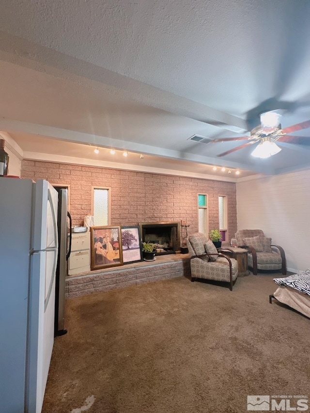 695 York Way, Sparks, NV 89431 - living area featuring carpet, a fireplace, brick wall, and a ceiling fan