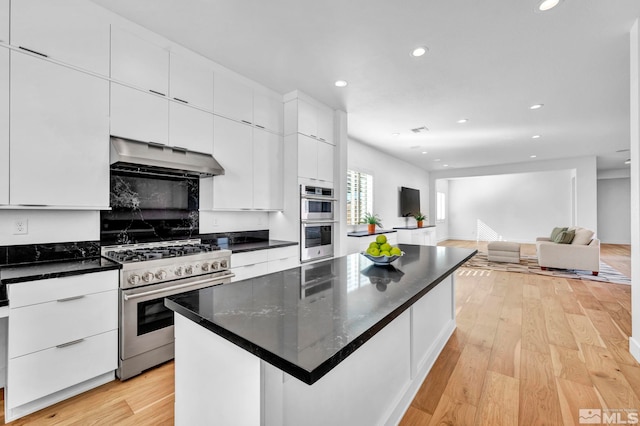 2277 White Clay Dr, Reno, NV 89521 - kitchen featuring appliances with stainless steel finishes, under cabinet range hood, white cabinetry, light wood finished floors, and recessed lighting