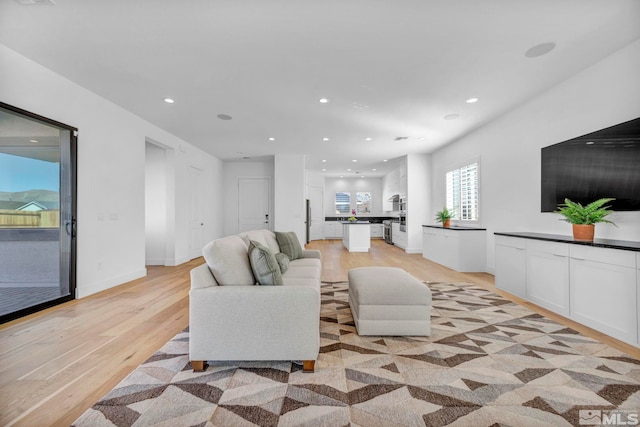 2277 White Clay Dr, Reno, NV 89521 - living area featuring light wood-style floors, recessed lighting, and baseboards