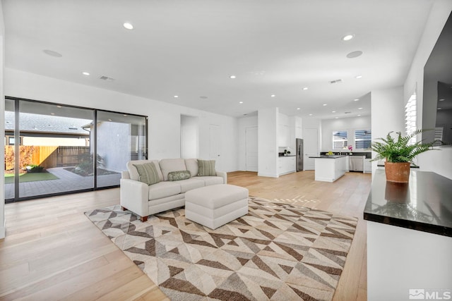 2277 White Clay Dr, Reno, NV 89521 - living room with light wood-style floors and recessed lighting