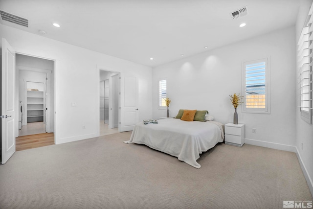 2277 White Clay Dr, Reno, NV 89521 - carpeted bedroom featuring multiple windows, baseboards, recessed lighting, and washer / clothes dryer