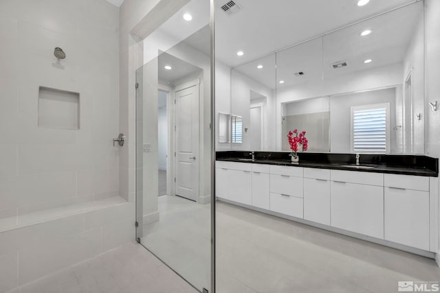 2277 White Clay Dr, Reno, NV 89521 - bathroom with a walk in shower, double vanity, recessed lighting, and tile patterned floors