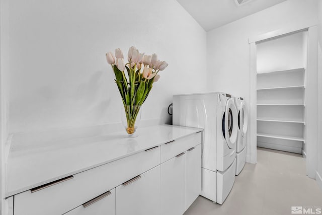 2277 White Clay Dr, Reno, NV 89521 - laundry area with washing machine and clothes dryer and cabinet space