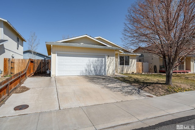 1342 Cahi Cir, Gardnerville, NV 89460 - ranch-style home with an attached garage, driveway, and fence