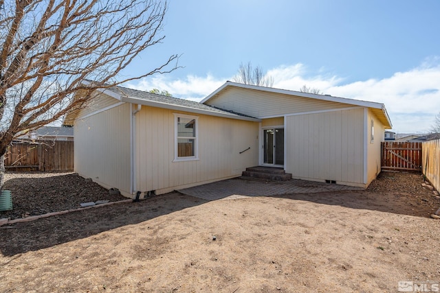 1342 Cahi Cir, Gardnerville, NV 89460 - back of property with a fenced backyard, a patio area, crawl space, and entry steps