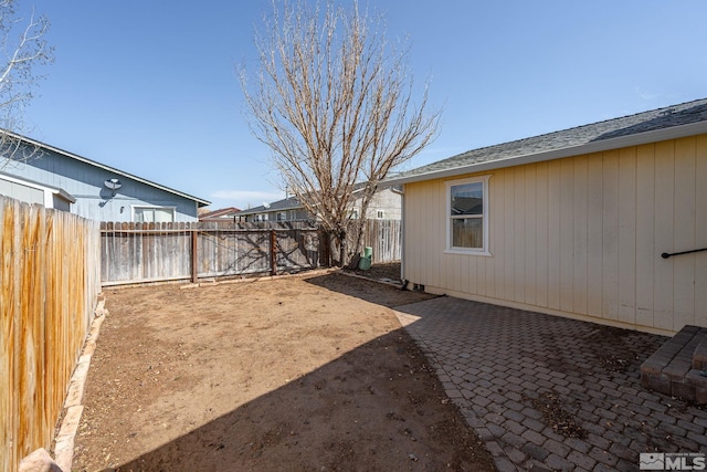 1342 Cahi Cir, Gardnerville, NV 89460 - fenced backyard with a patio area