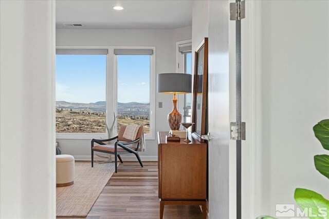 10241 Zuni Ridge Trl, Reno, NV 89511 - living area with a mountain view, wood finished floors, recessed lighting, and baseboards