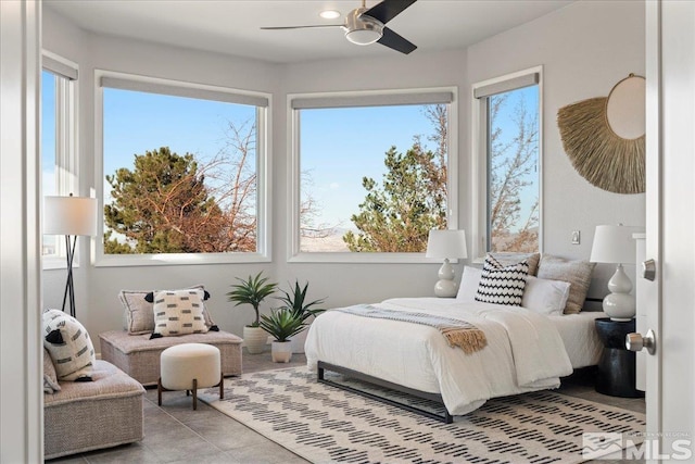 10241 Zuni Ridge Trl, Reno, NV 89511 - bedroom with multiple windows, tile patterned floors, and ceiling fan