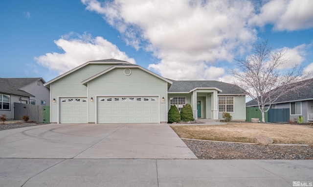 2976 Del Rio Ln, Minden, NV 89423 - ranch-style home with a garage, concrete driveway, and fence