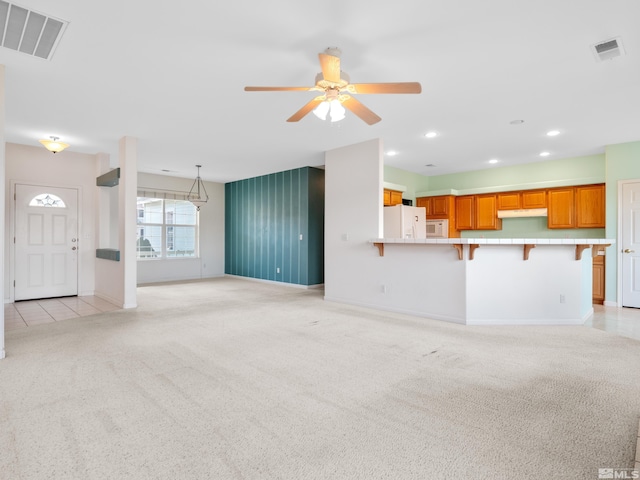 2976 Del Rio Ln, Minden, NV 89423 - unfurnished living room with light carpet, ceiling fan, baseboards, and recessed lighting