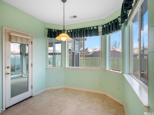 2976 Del Rio Ln, Minden, NV 89423 - unfurnished dining area with baseboards and tile patterned floors