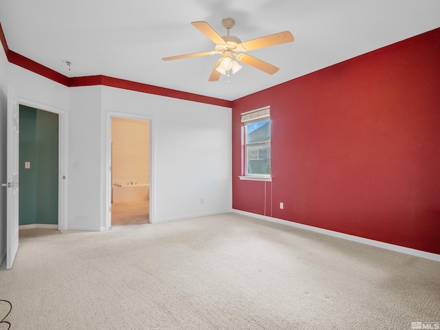 2976 Del Rio Ln, Minden, NV 89423 - unfurnished bedroom with baseboards, carpet flooring, a ceiling fan, and ensuite bathroom
