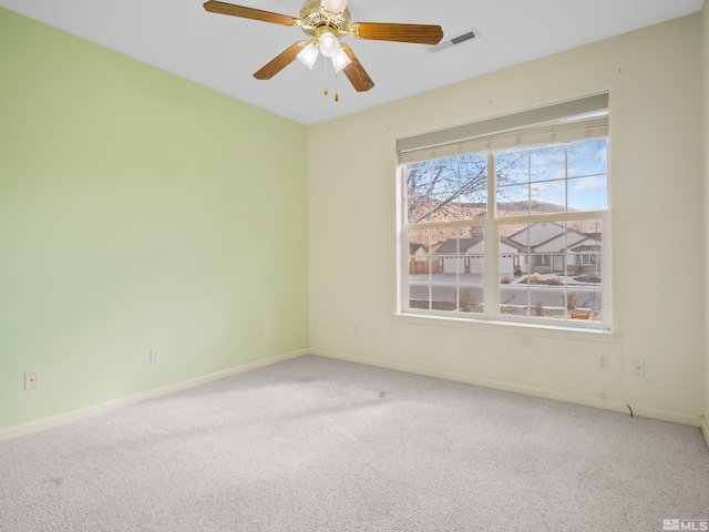 2976 Del Rio Ln, Minden, NV 89423 - carpeted spare room with baseboards and ceiling fan