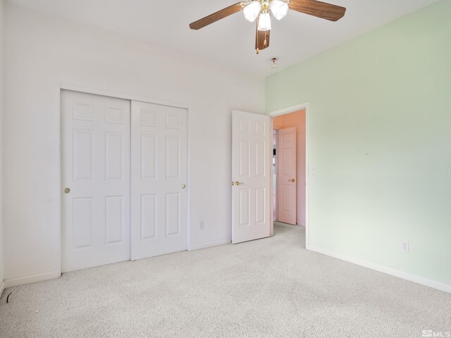 2976 Del Rio Ln, Minden, NV 89423 - unfurnished bedroom featuring carpet, baseboards, a closet, and ceiling fan