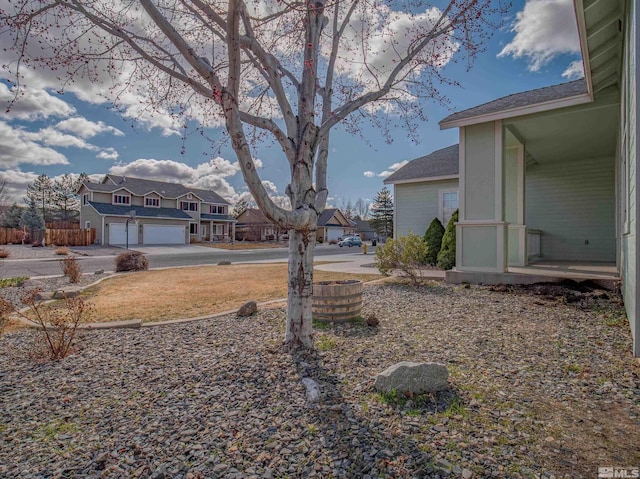 2976 Del Rio Ln, Minden, NV 89423 - view of yard featuring a garage and a residential view