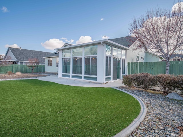2976 Del Rio Ln, Minden, NV 89423 - rear view of property with a sunroom, a shingled roof, and a patio area