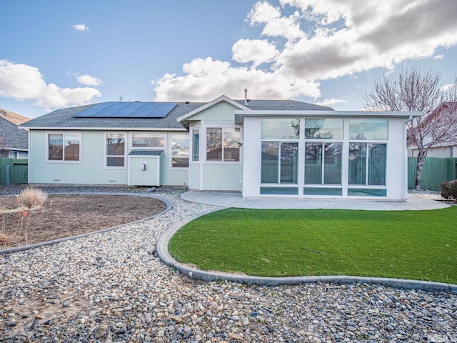 2976 Del Rio Ln, Minden, NV 89423 - rear view of property with solar panels, a sunroom, and a shingled roof