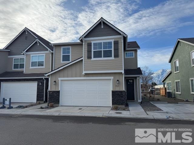 1021 Home Stretch Ln Unit 19, Minden, NV 89423 - craftsman-style house featuring board and batten siding, stone siding, an attached garage, and central air condition unit