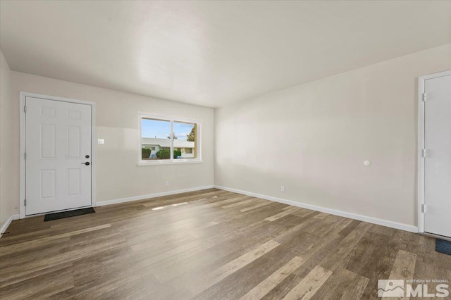 1180 Xman Way, Sparks, NV 89431 - unfurnished living room with wood finished floors and baseboards