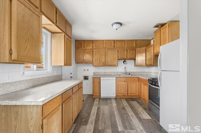 1180 Xman Way, Sparks, NV 89431 - kitchen with white appliances, a sink, wood finished floors, light countertops, and tasteful backsplash
