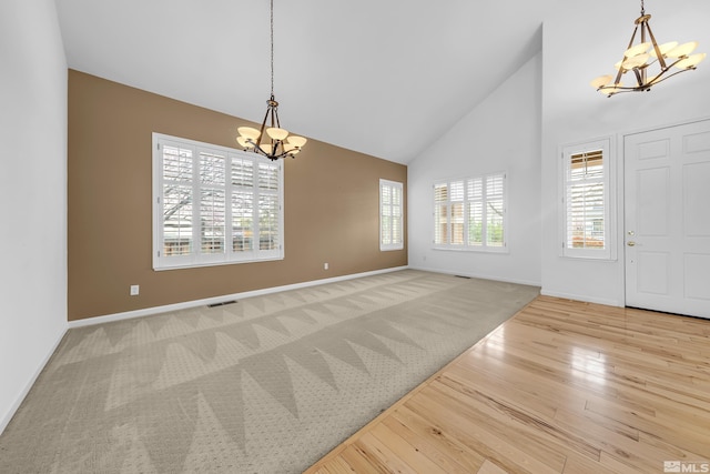 6841 Talmedge Cir, Sparks, NV 89436 - foyer featuring a chandelier, high vaulted ceiling, baseboards, and wood finished floors