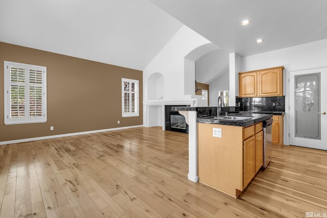 6841 Talmedge Cir, Sparks, NV 89436 - kitchen with a sink, vaulted ceiling, open floor plan, healthy amount of natural light, and a fireplace