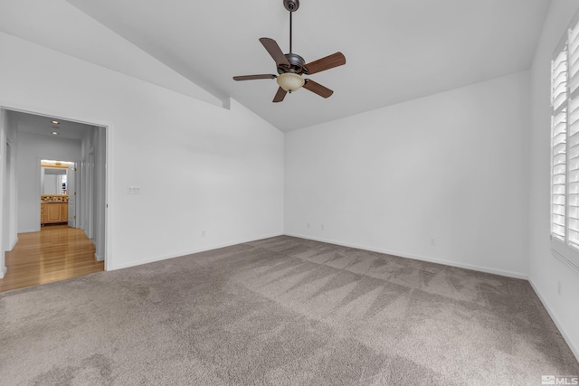 6841 Talmedge Cir, Sparks, NV 89436 - spare room with carpet flooring, vaulted ceiling, a ceiling fan, and baseboards