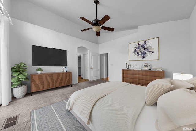 6841 Talmedge Cir, Sparks, NV 89436 - bedroom featuring carpet, arched walkways, lofted ceiling, and a ceiling fan