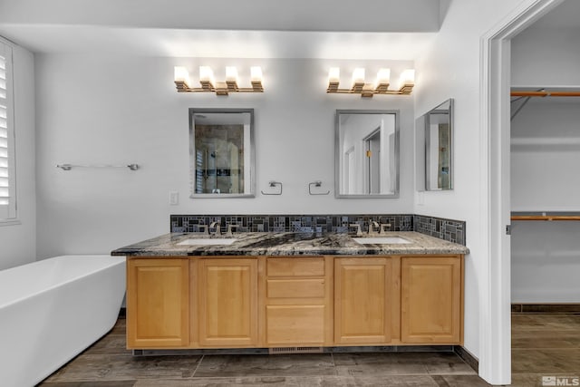 6841 Talmedge Cir, Sparks, NV 89436 - full bath with double vanity, a freestanding bath, a walk in closet, and a shower