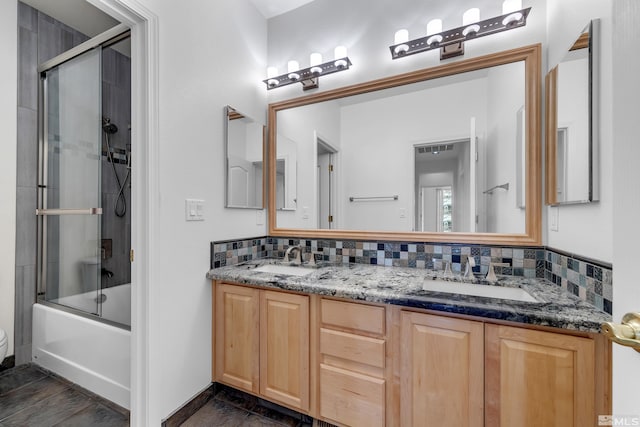 6841 Talmedge Cir, Sparks, NV 89436 - bathroom with double vanity, toilet, decorative backsplash, and combined bath / shower with glass door