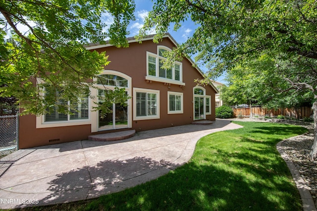 6841 Talmedge Cir, Sparks, NV 89436 - back of house featuring stucco siding, a patio, and crawl space