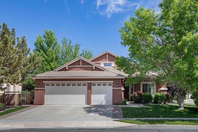6841 Talmedge Cir, Sparks, NV 89436 - view of front of home with stucco siding, concrete driveway, a garage, and a tiled roof