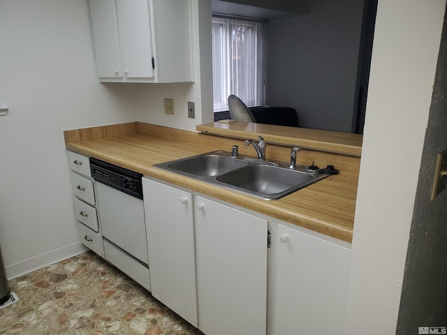 2341 Roundhouse Rd, Sparks, NV 89431 - kitchen with a sink, white dishwasher, white cabinets, light countertops, and baseboards