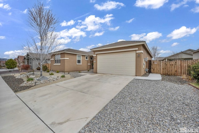 132 Egan Ave, Dayton, NV 89403 - single story home featuring stucco siding, fence, concrete driveway, and a garage