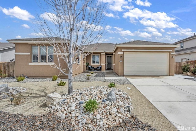 132 Egan Ave, Dayton, NV 89403 - ranch-style home featuring stucco siding, fence, a garage, and concrete driveway