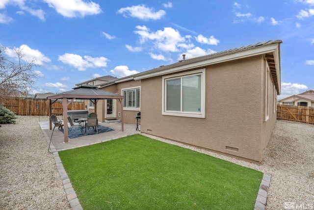 132 Egan Ave, Dayton, NV 89403 - back of property featuring a gazebo, a patio, and stucco siding