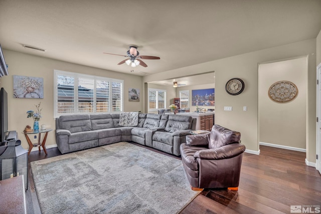 132 Egan Ave, Dayton, NV 89403 - living area featuring ceiling fan, dark wood-style flooring, and baseboards