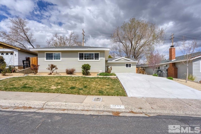 ranch-style home with driveway and a front lawn