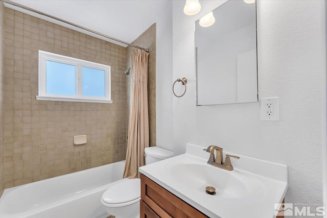 bathroom featuring shower / bath combo, toilet, and vanity