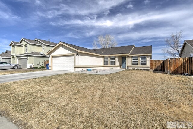 261 Brent St, Fallon, NV 89406 - view of front of house with driveway, an attached garage, and stucco siding
