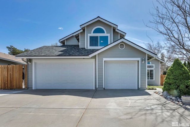 1678 Glen Oaks Dr, Reno, NV 89523 - view of front of house featuring fence, driveway, and roof with shingles