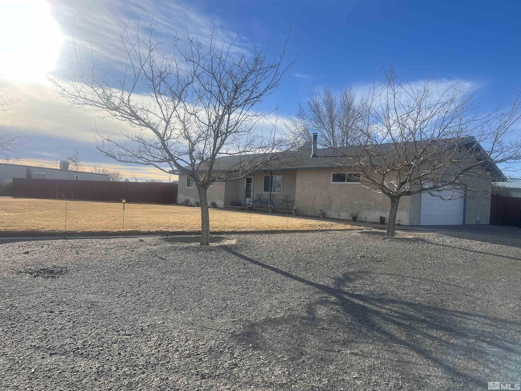 6467 Teal Dr, Fallon, NV 89406 - single story home with driveway, an attached garage, and stucco siding