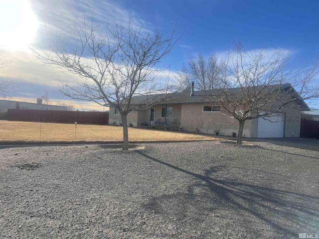 6467 Teal Dr, Fallon, NV 89406 - single story home with driveway, an attached garage, and stucco siding