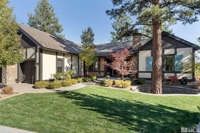 20588 Chanson Way, Reno, NV 89511 - tudor house featuring a front lawn, a chimney, and stucco siding