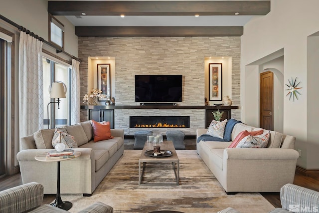 20588 Chanson Way, Reno, NV 89511 - living room with beamed ceiling, a stone fireplace, wood finished floors, and a towering ceiling