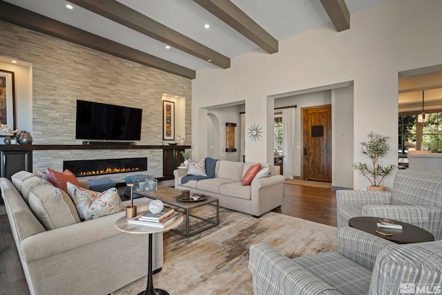 20588 Chanson Way, Reno, NV 89511 - living area with beam ceiling, wood finished floors, a stone fireplace, and recessed lighting