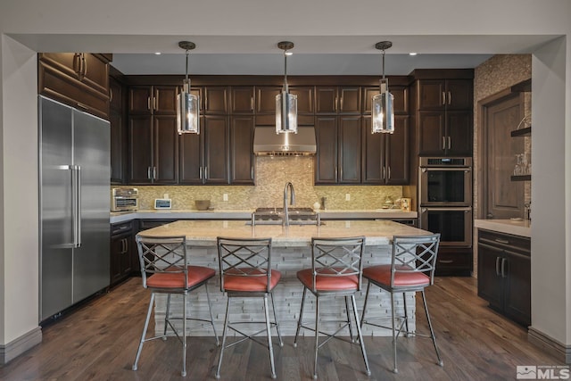 20588 Chanson Way, Reno, NV 89511 - kitchen featuring appliances with stainless steel finishes, dark brown cabinetry, and dark wood-type flooring
