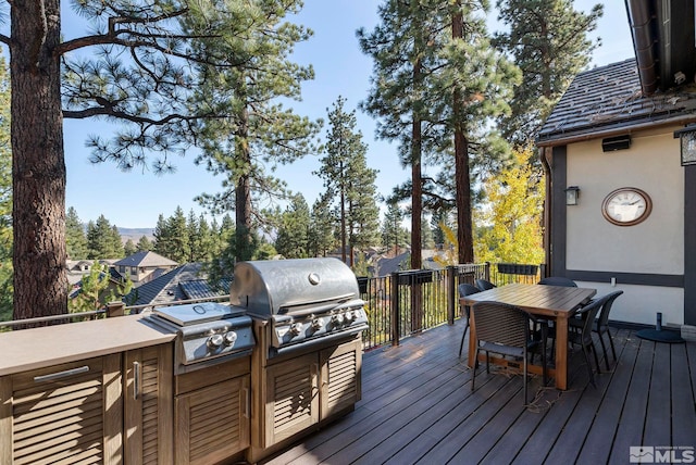 20588 Chanson Way, Reno, NV 89511 - wooden deck with grilling area and outdoor dining area