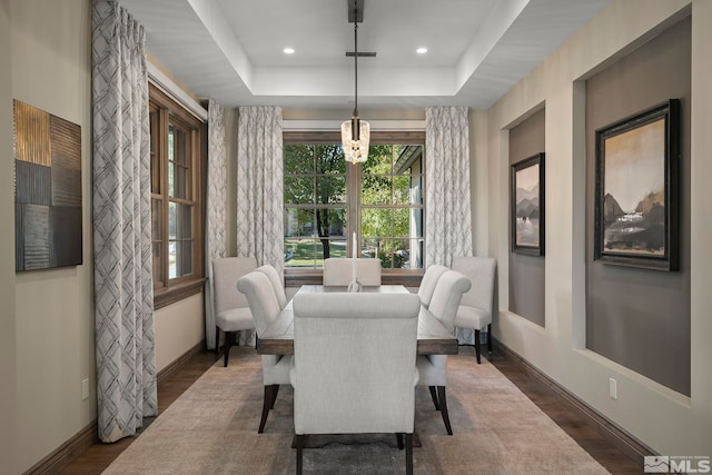 20588 Chanson Way, Reno, NV 89511 - dining space featuring baseboards, a tray ceiling, dark wood-style floors, a chandelier, and recessed lighting