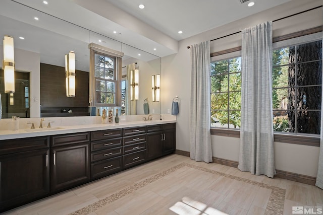 20588 Chanson Way, Reno, NV 89511 - full bathroom with healthy amount of natural light, recessed lighting, baseboards, double vanity, and a tub to relax in